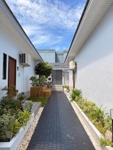 a walkway leading to the entrance of a house at Aonang nine poolvilla resort in Ao Nang 