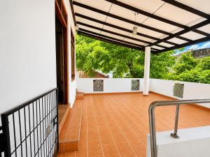 a balcony of a house with a fence at Sattvic Ceylon- Wellness Homestay in Colombo