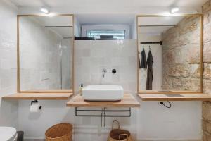 a bathroom with a sink and a shower at Waldwagen Altes Forstamt Sinntal in Sinntal