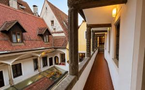 an alleyway between two buildings with a pool at DORMERO MaHo Steyr in Steyr