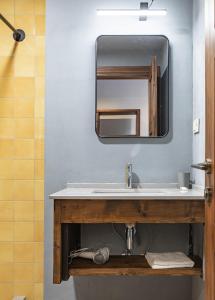 a bathroom with a sink and a mirror at Lasiim in Mestia