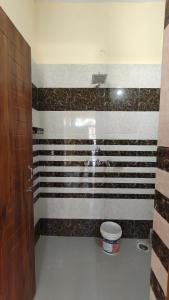 a bathroom with black and white stripes on the wall at The Stay Spot in Kharar