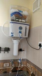 a sink in a kitchen with a water fountain at The Stay Spot in Kharar