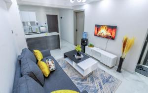 a living room with a couch and a table at Kindaruma Homes Apartments in Nairobi