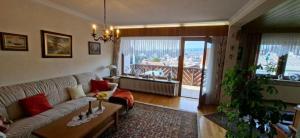a living room with a couch and a table at FeWo Christa in Marpingen