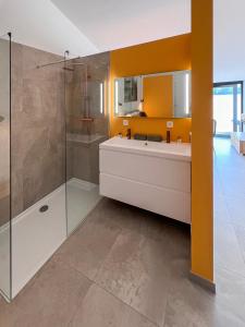 a bathroom with a tub and a sink and a shower at Whaaw Herentals in Herentals +64 photos