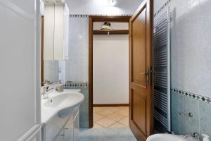 a bathroom with a sink and a toilet and a shower at I Bibi Vacation Home in Viareggio +21 photos