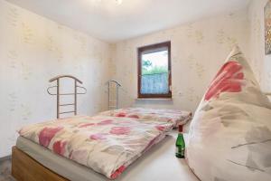 a bedroom with a bed and a window at Ferienhaus Cajo in Dahmen