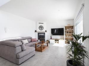 a living room with a couch and a table at Casa Regalo in Dúrcal