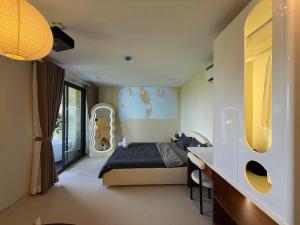 a bedroom with a bed and a desk in it at Cưng Homestay SG in Ho Chi Minh City +111 photos