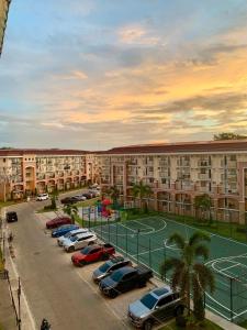 a parking lot with a tennis court in front of a building at Casa Bonita Davao in Davao City