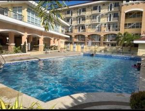 a large swimming pool in front of a building at Casa Bonita Davao in Davao City