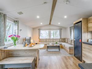 a kitchen and living room with a couch and a table at No29 - Uk52060 in Hartland