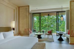 a bedroom with a bed and a living room at THE BARAI HUA HIN - The Unbound Collection by Hyatt in Hua Hin +39 photos