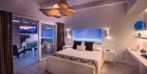 a bedroom with a bed and a desk and a window at Destino di Nora in Pula +41 photos