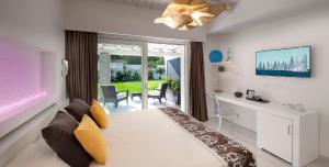 a living room with a couch and a desk in a room at Destino di Nora in Pula