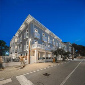a large building on the corner of a street at Palatium Riccione Suite in Riccione