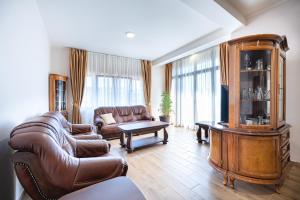 a living room with a couch and a table at Hotel Perun in Budva