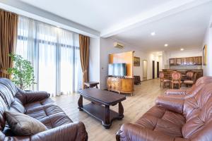 a living room with a couch and a table at Hotel Perun in Budva
