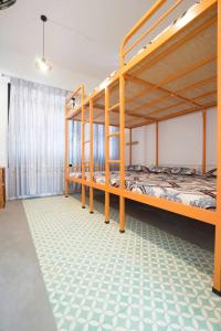 a room with two bunk beds in a room at OHA Homestay in Quy Nhon