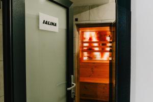 a door with a sign that reads jamaica next to it at Camping Colibita in Colibiţa