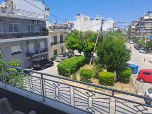 a view of a city street from a balcony at Aspasia's apartment in Mytilene