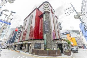 a building on a street in a city at 부평 호텔 루와 in Pup'yŏng-yŏk