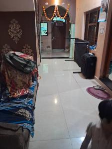a hallway of a store with a room with luggage at Radhe house in Gwalior