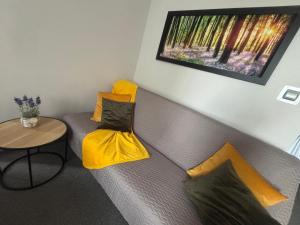 a living room with a couch with a table at 208 Apartment Ania in Koszalin