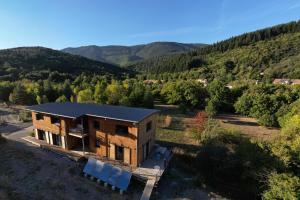an aerial view of a house in the mountains at Ecogîtes Camparols in Prémian