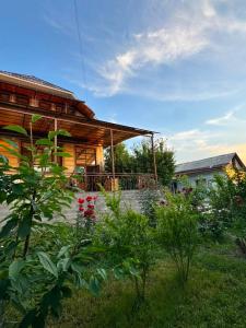 a house with a garden in front of it at Uya Nest Osh in Osh