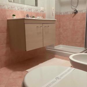 a bathroom with a sink and a toilet and a tub at Incanto Stabiese in Castellammare di Stabia