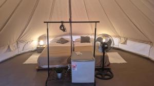 a bedroom with a bed in a tent at Camping Playa Taray in Islantilla +65 photos