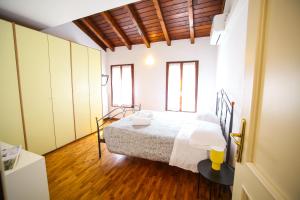 a bedroom with a bed in a room at Guest House Rossana in Reggio Emilia