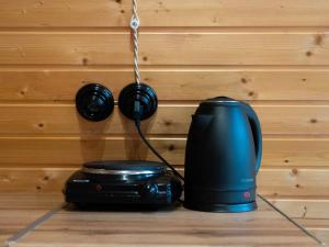 a camera and headphones hanging on a wall at Focus Point Drakhtik - Green Cabin in Drakhtik