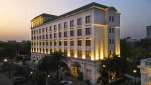 a large white building with lights on it at DLF Club 3 in Gurgaon