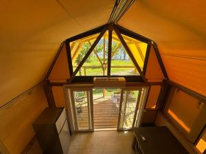 an overhead view of a room with a large window at Glamping Camping Rivabella in Lecco