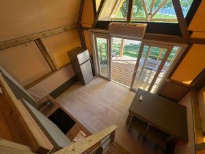 an overhead view of a kitchen with a refrigerator at Glamping Camping Rivabella in Lecco