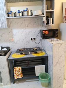 a model of a kitchen with a stove at BnB Studio Oasis Homes Machakos in Machakos