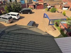 an overhead view of a parking lot with cars parked at Kibuli beijing hotel in Kampala