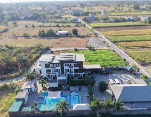 an aerial view of a house with a swimming pool at Reynaldos Place Corporation in Vigan