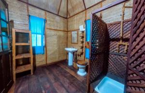 a bathroom with a toilet and a sink at Pemba Eco Lodge in Kengeja +96 photos