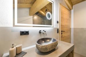 a bathroom with a bowl sink on a counter at Das Krumerhaus in Aschau +66 photos
