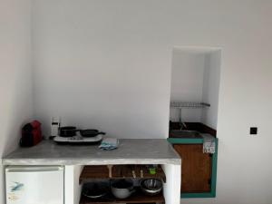 a kitchen with a counter with pots and pans at Ontas in Tholária