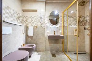 a bathroom with a sink and a toilet and a shower at Hotel Perun in Budva +34 photos