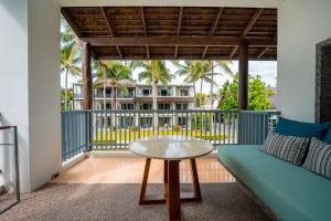 a living room with a couch and a table at Veranda Resort & Villas Hua Hin Cha Am in Cha Am