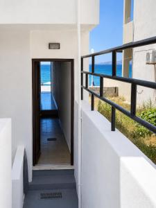 a house with a view of the beach at Oikos Apartments in Haraki