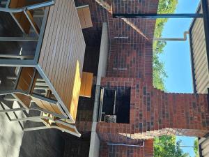 a reflection of a brick building with a window at Wave Dancer 2-Bedroom Apartment in St Lucia