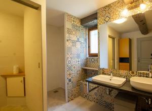 a bathroom with a sink and a mirror at Moulin neuf de combecave in Saint-Amand-de-Vergt +23 photos