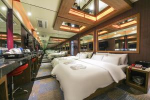a room with four large beds in it with at 부평 호텔 루와 in Pup'yŏng-yŏk